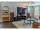 Comfortable living room features a flat screen tv, ceiling fan, and a view of the outside at 459 Millwood Pl, Winter Garden, FL 34787