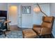 Relaxing office area with accent chair and overhead lamp, creating a comfortable atmosphere at 459 Millwood Pl, Winter Garden, FL 34787