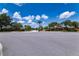 View of the Covington Chase entrance with brick signage and lush landscaping on a sunny day at 459 Millwood Pl, Winter Garden, FL 34787