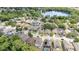 Aerial view of homes in a neighborhood with green trees and a large lake at 491 Freeman St, Longwood, FL 32750