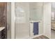 Bathroom featuring walk-in shower with glass door and shuttered window at 491 Freeman St, Longwood, FL 32750