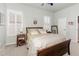 A simple bedroom design with a framed bed and shuttered windows for natural light at 491 Freeman St, Longwood, FL 32750