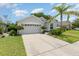 Inviting one-story home with a well-maintained lawn and two-car garage at 491 Freeman St, Longwood, FL 32750