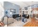 Spacious living room with wood floors, modern furniture, and stylish decor at 491 Freeman St, Longwood, FL 32750