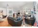 Bright living room with hardwood floors and large windows at 491 Freeman St, Longwood, FL 32750