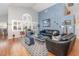 Inviting living room featuring hardwood floors, high ceilings, and plenty of natural light at 491 Freeman St, Longwood, FL 32750