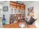 Inviting Living room featuring hard wood floors, book shelves, and modern art at 491 Freeman St, Longwood, FL 32750
