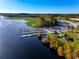Stunning aerial view of a public boat ramp on a river, featuring multiple docks and picnic pavilions at 550 Orient Ave, Debary, FL 32713