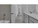 Modern bathroom includes a sink, a bathtub, a shower and toilet at 550 Orient Ave, Debary, FL 32713