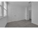 Neutral bedroom with gray carpet, white walls and trim, and a window providing natural light at 550 Orient Ave, Debary, FL 32713