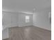 Open concept living space with neutral walls, wood floors and recessed lighting offers versatile living options at 550 Orient Ave, Debary, FL 32713