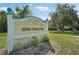 Gemini Springs Park sign surrounded by lush landscaping on a sunny day at 550 Orient Ave, Debary, FL 32713