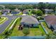 Aerial view of a property with a screened patio, fenced yard, and mature landscaping in a quiet neighborhood at 570 Cascading Creek Ln, Winter Garden, FL 34787
