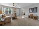 Bright living room with a neutral palette and stylish coastal decor at 570 Cascading Creek Ln, Winter Garden, FL 34787
