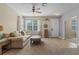 Comfortable living room featuring neutral decor and a welcoming atmosphere at 570 Cascading Creek Ln, Winter Garden, FL 34787