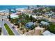 An aerial view of a charming blue home nestled among lush greenery and palm trees near the beach at 600 Bostwick Ave, Daytona Beach, FL 32118