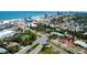 An aerial view of a charming blue home nestled among lush greenery and palm trees near the beach at 600 Bostwick Ave, Daytona Beach, FL 32118