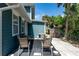Cozy back patio with outdoor seating, grill, and a view of the green backyard at 600 Bostwick Ave, Daytona Beach, FL 32118