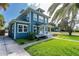 Charming two-story home with a landscaped lawn and inviting white-framed windows at 600 Bostwick Ave, Daytona Beach, FL 32118