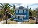 Charming two-story home with a landscaped lawn and inviting white-framed windows at 600 Bostwick Ave, Daytona Beach, FL 32118