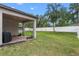 Spacious backyard with brick patio, green lawn, and privacy fence at 604 Fosters Grove Loop, Oviedo, FL 32765