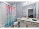 Cozy bathroom featuring a combination shower and tub with bright colored shower curtain at 604 Fosters Grove Loop, Oviedo, FL 32765