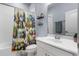 Bathroom featuring a tub and shower with a colorful curtain and a vanity with sink at 604 Fosters Grove Loop, Oviedo, FL 32765
