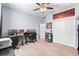 Well-lit bedroom featuring a dedicated office space and a neutral color palette at 604 Fosters Grove Loop, Oviedo, FL 32765