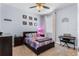 Bedroom with carpet, a ceiling fan, a window with curtains, and colorful decor at 604 Fosters Grove Loop, Oviedo, FL 32765