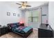 Bedroom with carpet, a ceiling fan, a window with curtains, and baseball-themed decor at 604 Fosters Grove Loop, Oviedo, FL 32765