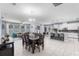 Bright living space with a kitchen, dining, and living area featuring an open concept and tile flooring at 604 Fosters Grove Loop, Oviedo, FL 32765