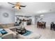 Spacious open floor plan with combined kitchen, dining, and living areas with lots of light and modern decor at 604 Fosters Grove Loop, Oviedo, FL 32765