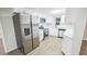 Modern kitchen featuring stainless steel appliances and white cabinetry at 6354 Hill Rd, Orlando, FL 32810