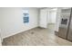 Open-concept kitchen that flows into living area with new floors and fresh paint at 6354 Hill Rd, Orlando, FL 32810