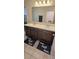 Bathroom featuring double sinks with sleek dark cabinetry and modern fixtures and 