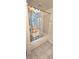 Clean bathroom featuring a white tub with a colorful, whimsical shower curtain at 651 Taft Dr, Davenport, FL 33837