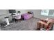 Bedroom featuring a comfortable bed, desk, chair, and carpeting at 651 Taft Dr, Davenport, FL 33837