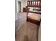 Bedroom with a wooden bunk bed, dresser, and gray carpet at 651 Taft Dr, Davenport, FL 33837