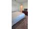 Bedroom featuring a queen-sized bed, dresser, and carpeting at 651 Taft Dr, Davenport, FL 33837