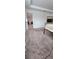 Large bedroom with neutral carpet, connecting door, and space for furnishings at 651 Taft Dr, Davenport, FL 33837