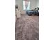 Cozy bedroom with plush gray carpeting and a window with natural light at 651 Taft Dr, Davenport, FL 33837