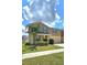 Lovely home featuring manicured lawn, a welcoming driveway, and charming blue shutters at 651 Taft Dr, Davenport, FL 33837
