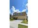 Charming two-story home featuring a well-maintained lawn and blue shutters, perfect for curb appeal at 651 Taft Dr, Davenport, FL 33837