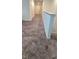 Hallway on the second level with carpeting and access to other rooms at 651 Taft Dr, Davenport, FL 33837