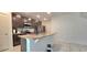 Modern kitchen features granite countertops, stainless steel appliances, and a functional island at 651 Taft Dr, Davenport, FL 33837