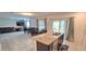 Stylish kitchen with granite island, stainless appliances, and seamless flow to the living areas at 651 Taft Dr, Davenport, FL 33837