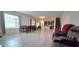 Spacious living area with tile floors, an open floor plan, and a staircase at 651 Taft Dr, Davenport, FL 33837