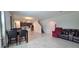 Expansive living area with tile flooring, versatile layout, and comfortable seating arrangement at 651 Taft Dr, Davenport, FL 33837
