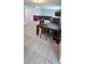 Open-concept living and dining area featuring tile flooring, furniture, and a bright atmosphere at 651 Taft Dr, Davenport, FL 33837