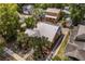Aerial view of a charming home surrounded by lush landscaping and mature trees at 706 Hillcrest St, Orlando, FL 32803